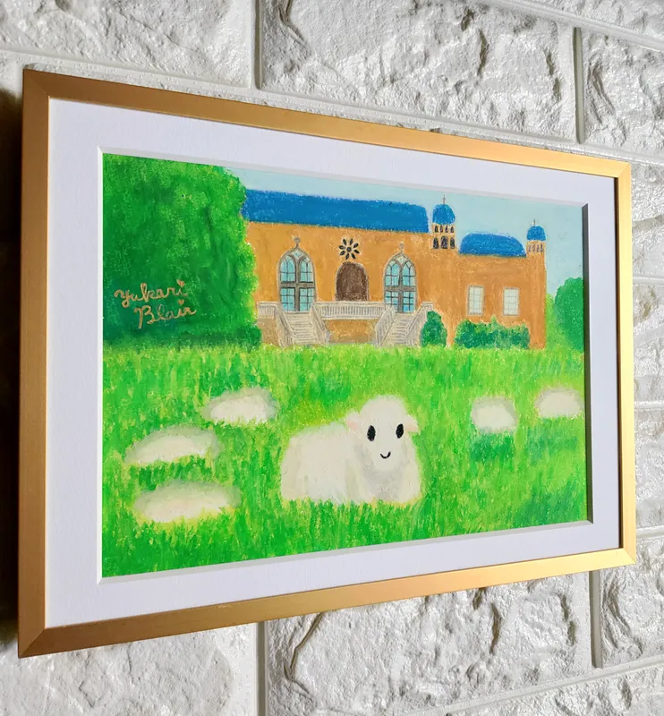 草をはむコッツウォルズの羊さん