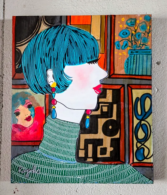 瑠璃色の髪の女性